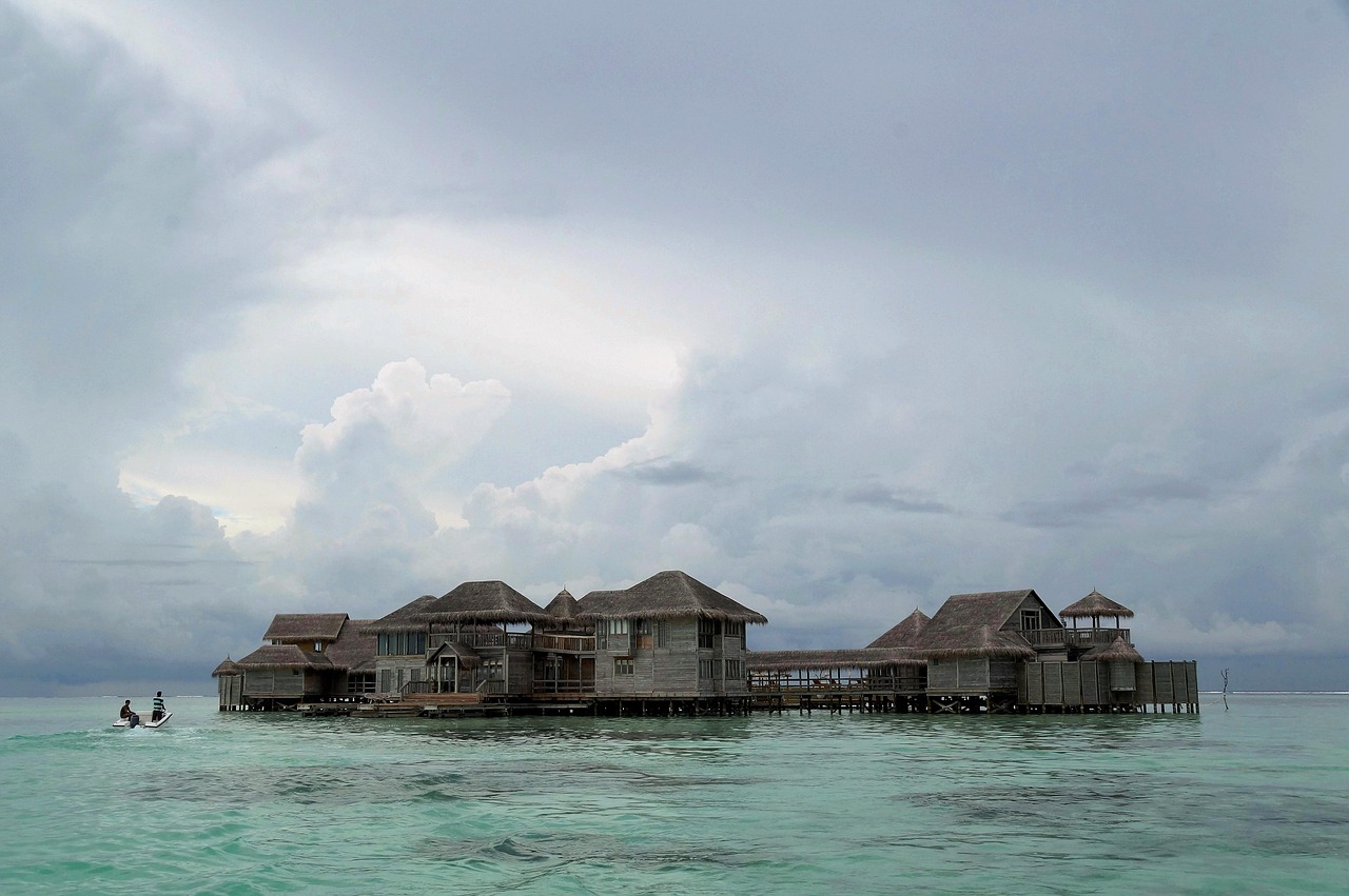 An overwater villa above a clear tropical lagoon